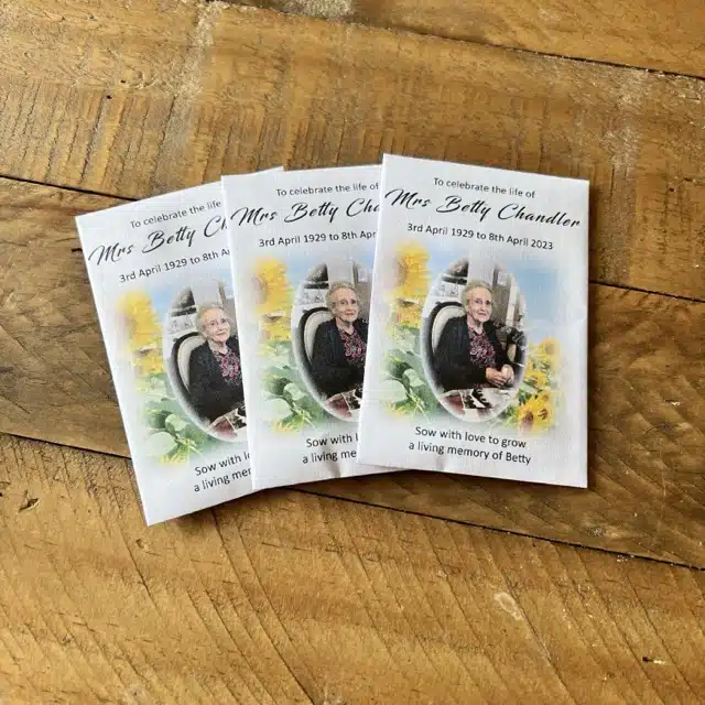 Personalised white envelopes using a sunflower design and a loved one's picture