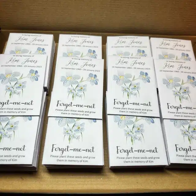 Personalised white envelopes using a forget me not watercolour design